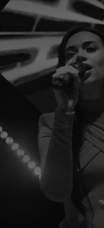 Performer on stage under stage lighting